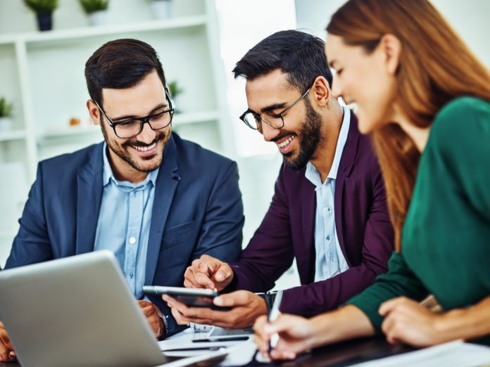Team of developers working on AI projects in a modern office