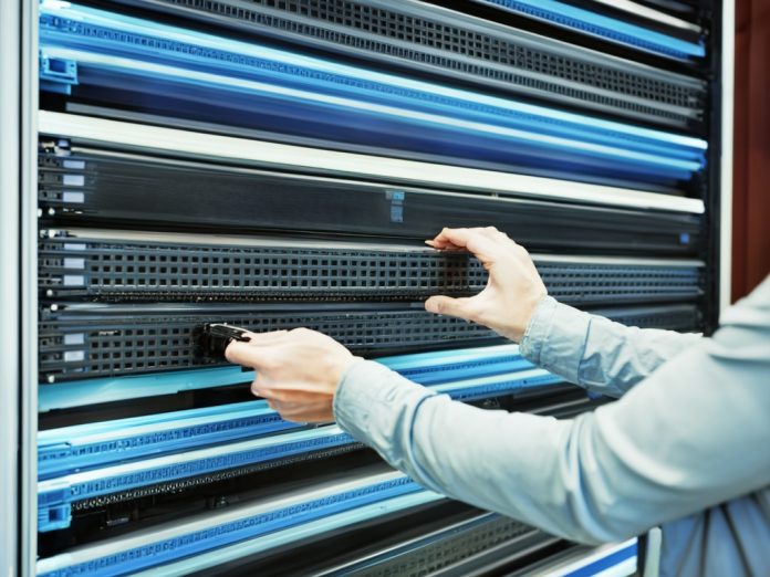 Advanced server room with technicians working on AI-optimized hardware.