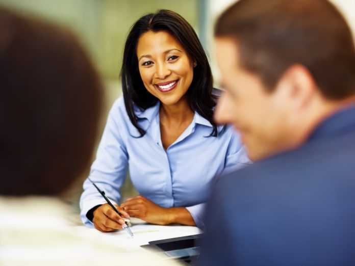 People having a strategic discussion in a modern office.