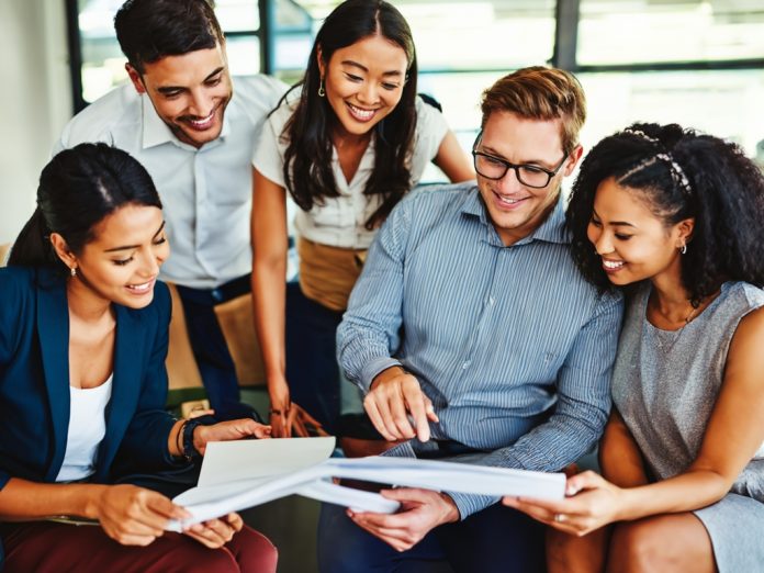 Business professionals reviewing growth charts in a modern office setting