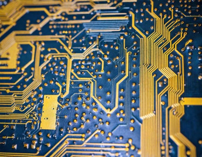 Detailed close-up of advanced semiconductor components on a circuit board with glowing elements