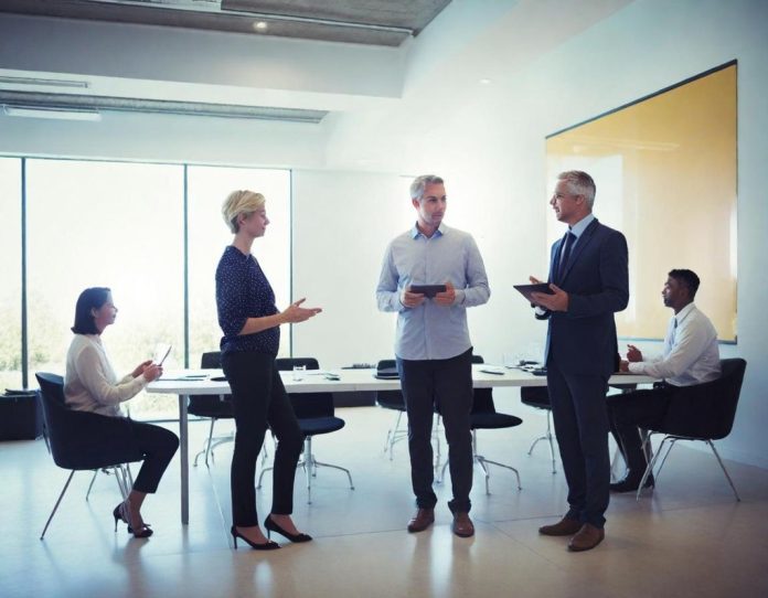 Technology professionals networking and discussing innovations at a major industry conference