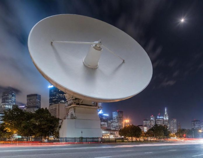 Satellite communication equipment being moved through urban environment under cover of darkness