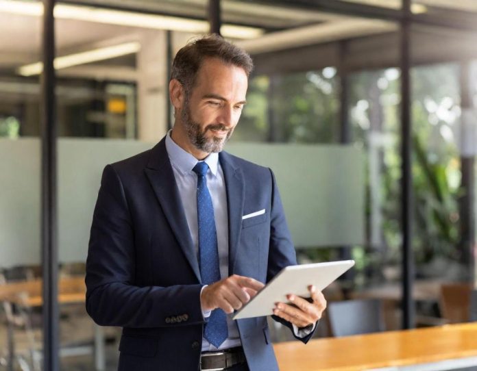 Financial advisor and client reviewing investment data together in a contemporary office setting