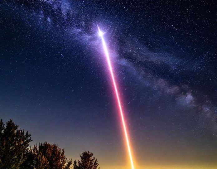 Nighttime rocket launch creating dramatic light trail against starry sky